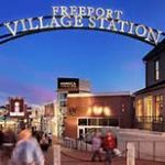 Entrance to Freeport Village Station at dusk, perfect for vacationing in Maine or exploring what to do in Maine.