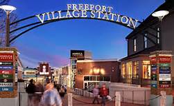 Entrance to Freeport Village Station at dusk, perfect for vacationing in Maine or exploring what to do in Maine.